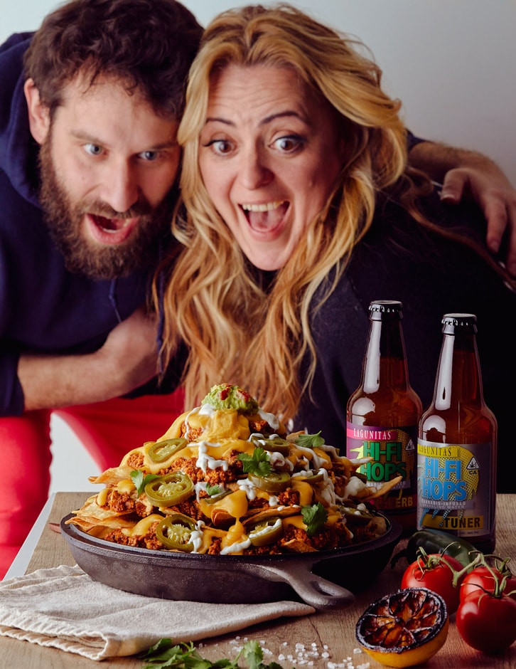 A couple enjoying a plate of nachos