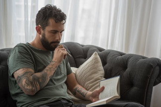 Man vaping on a couch