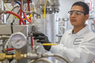 Male lab worker extracting cannabis oil