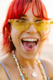 Young woman enjoying a cannabis gummy